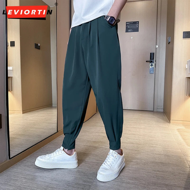 Pantaloni casual primavera/estate a tinta unita per uomo, pantaloni in seta ghiacciata, stile coreano, pantaloni eleganti con cerniera sulla caviglia, pantaloni per uomo.