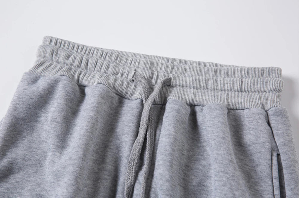 Pantaloni da jogging in pile senza stampa, pantaloni da corsa per uomo, pantaloni sportivi bianchi da uomo, pantaloni all'ingrosso per uomo, pantalones de hombre.